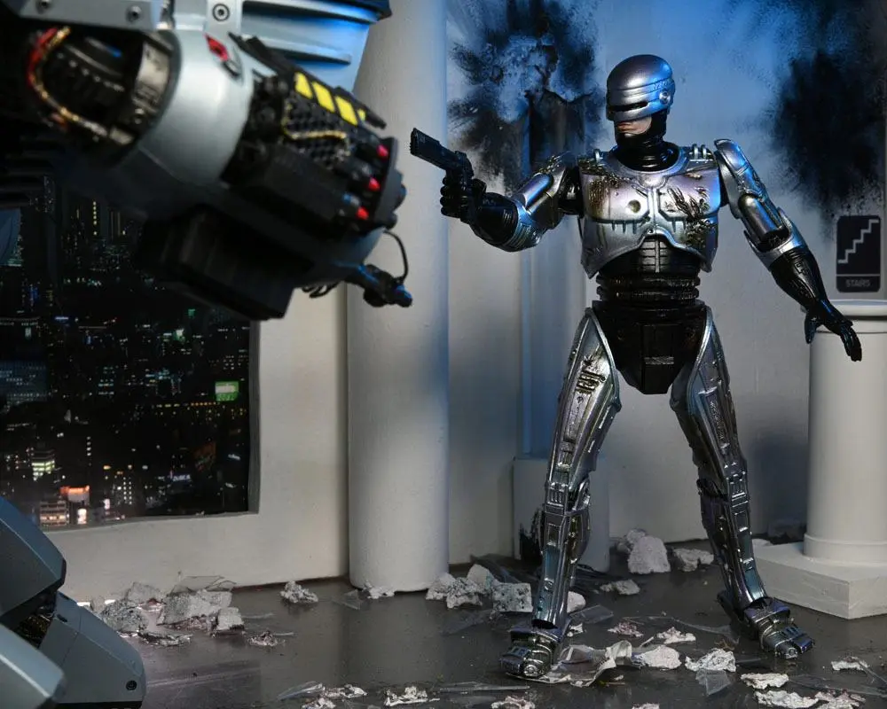 Akcijska figura RoboCop Ultimate Battle Damaged RoboCop s stolom 18 cm fotografija izdelka