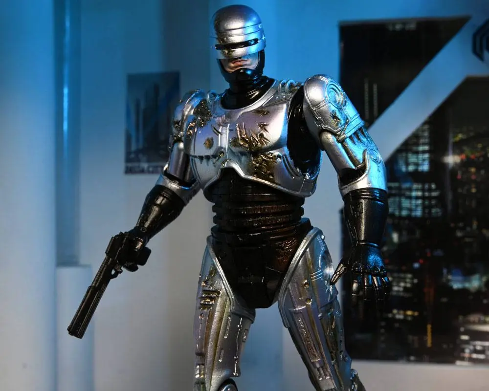 Akcijska figura RoboCop Ultimate Battle Damaged RoboCop s stolom 18 cm fotografija izdelka