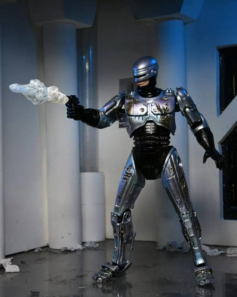 Akcijska figura RoboCop Ultimate Battle Damaged RoboCop s stolom 18 cm fotografija izdelka